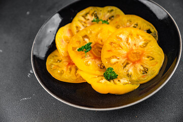 salad tomato yellow slice Cooking appetizer meal food snack on the table copy space food background rustic top view