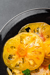 salad tomato yellow slice Cooking appetizer meal food snack on the table copy space food background rustic top view