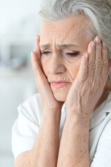 Close up portrait of a sick senior woman