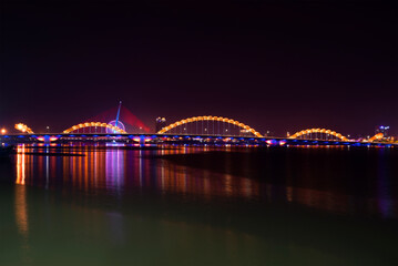 The Dragon Bridge on the Han River in night illumination. Da Nang, Vietnam