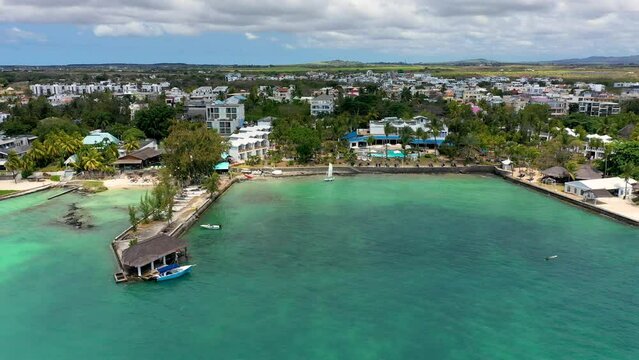 Aerial view of beautiful beach in Trou aux Biches, Mauritius. Trou aux biches, public beach at Mauritius islands, Africa. Beach with palms and blue ocean. Amazing Trou aux Biches, Mauritius
