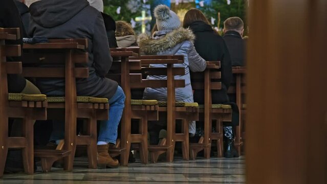 Anonymous People Praying in Catholic Church During Sunday Holy Mass Service