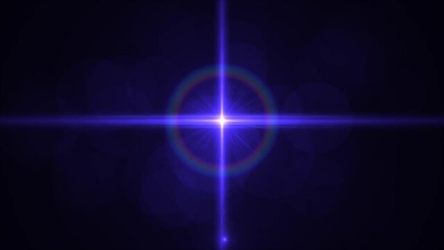 Bright blue starburst with colorful halo against a dark background.