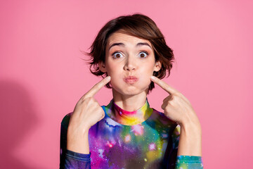 Photo of nice young woman hold breath pouted cheeks wear pullover isolated on pink color background