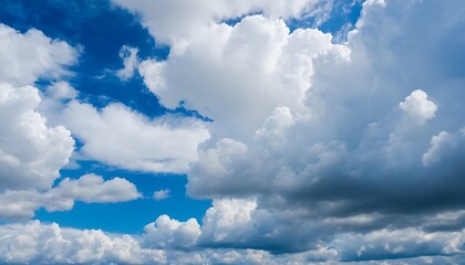 Vast blue sky filled with white clouds, ranging from large cumulus clouds to smaller puffs, bright sky - obrazy, fototapety, plakaty