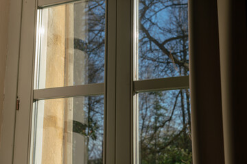double glazed window with light and transparency effects, the solar reflections highlight the structure of the window and its particular important element for a home.
