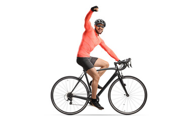 Profile shot of a cyclist with helmet and sunglasses riding a bicycle and gesturing happiness