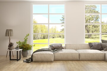 White living room with big windows, fabric sofa and summer landscape in window. Scandinavian interior design. 3D illustration