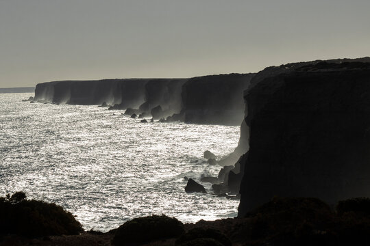 Dramatic shot of the iconic Nullarbor cliffs silhouetted at sunset