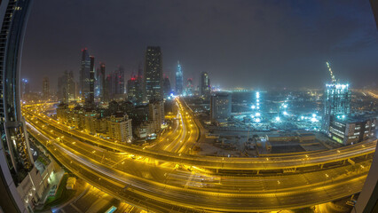 Fototapeta premium Dubai downtown skyline night to day aerial timelapse with traffic on highway