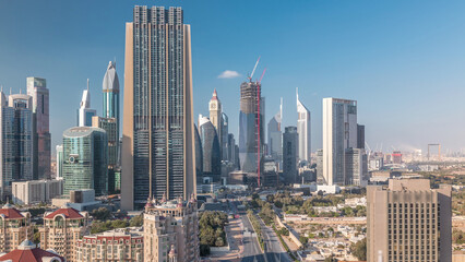 Aerial view on downtown and financial district in Dubai timelapse, United Arab Emirates with skyscrapers and highways.