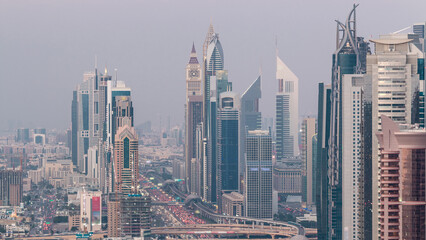 Fototapeta na wymiar Aerial view to skyscrapers on Dubai downtown and Sheikh Zayed road day to night timelapse, Dubai, United Arab Emirates
