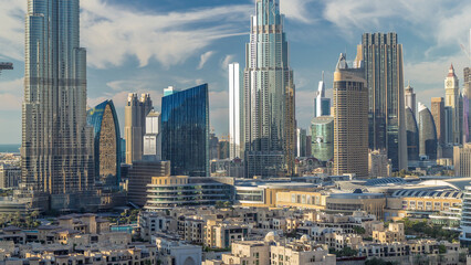 Dubai Downtown skyline timelapse with Burj Khalifa and other towers panoramic view from the top in...