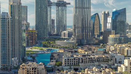 Dubai Downtown skyline timelapse with Burj Khalifa and other towers panoramic view from the top in Dubai