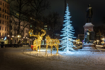 Christmas decorations and twinkle lights in Helsinki in December with the snow