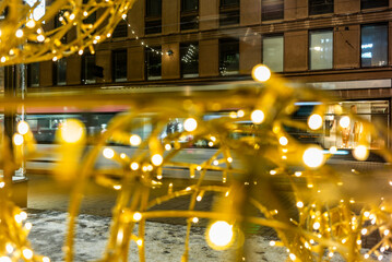 Christmas decorations and twinkle lights in Helsinki in December with the snow