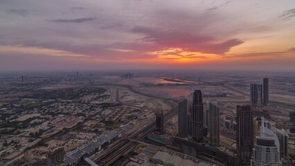 Fototapeta premium Downtown of Dubai in the morning timelapse during sunrise. Aerial view with towers and skyscrapers