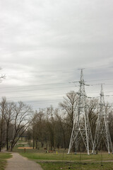 High voltage line close up on grey sky