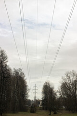 High voltage line close up on grey sky