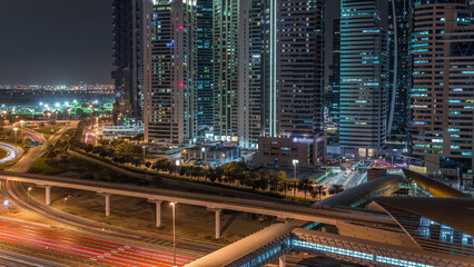 Fototapeta premium Aerial top view to Sheikh Zayed road near Dubai Marina and JLT timelapse, Dubai.