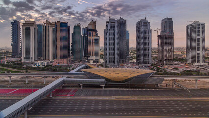 Naklejka premium Aerial top view to Sheikh Zayed road during sunrise near Dubai Marina and JLT timelapse, Dubai.