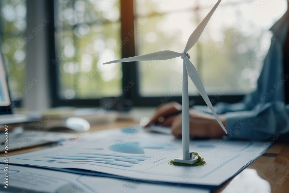 Poster a model wind turbine metaphorically represents green energy and innovation in a business setting wit