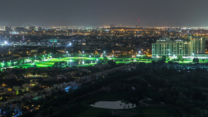 Aerial view to villas and houses with Golf course night timelapse