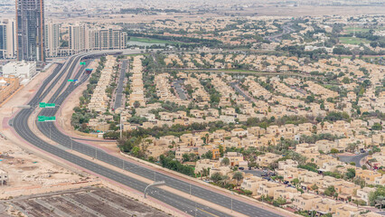 Aerial view of apartment houses and villas in Dubai city timelapse, United Arab Emirates