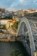 Fototapeta na wymiar Porto, Portugal. October 30, 2023: Panoramic view of the old town and the famous Dom Louis I bridge over the Douro River. Porto, Portugal.