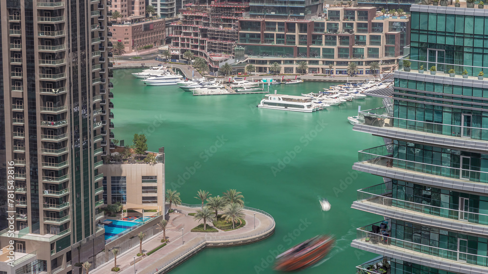 Wall mural waterfront promenade in dubai marina aerial timelapse. dubai, united arab emirates