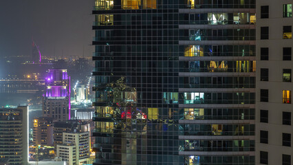 Modern skyscrapers in Jumeirah beach residence in Dubai, JBR aerial night timelapse