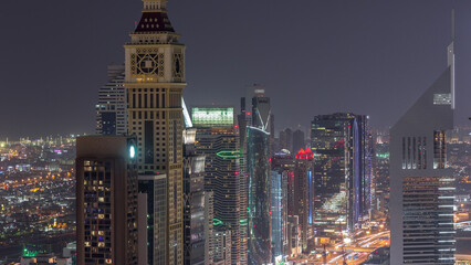 Fototapeta na wymiar Skyline of the buildings of Sheikh Zayed Road and DIFC aerial night timelapse in Dubai, UAE.