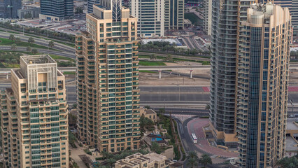 Dubai Marina skyscrapers and jumeirah lake towers view from the top aerial timelapse in the United Arab Emirates.