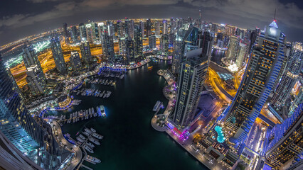 Dubai Marina skyscrapers and jumeirah lake towers view from the top aerial night timelapse in the...
