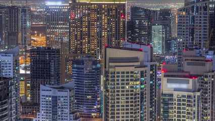 Fototapeta na wymiar Dubai Marina skyscrapers and jumeirah lake towers view from the top aerial night timelapse in the United Arab Emirates.