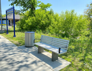 Bench in the park. Public bench in a railway station. Seatings near a litter garbage can. Train...