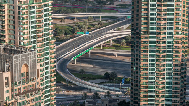 Dubai Marina highway exit between skyscrapers, spaghetti junction aerial view