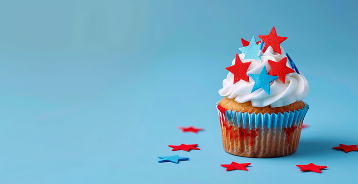 Photo of cupcake decorated with red, white, and blue stars on solid background. Web banner with empty space. 4th of July, President's Day, Independence Day, US National Day, Labor Day, Fourth of July