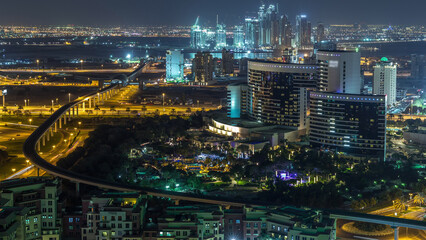 Night view of new modern buildings and lights in luxury Dubai city, United Arab Emirates Timelapse Aerial