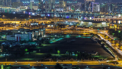 Fototapeta na wymiar View of new modern buildings at nighttime in luxury Dubai city, United Arab Emirates Timelapse Aerial