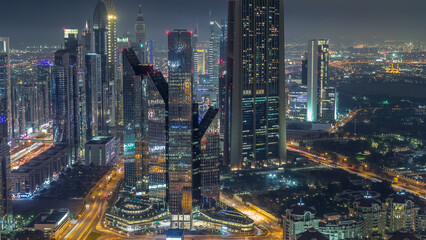 Dubai International Financial Centre district with modern skyscrapers night timelapse