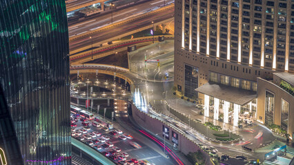 Dubai downtown street with busy traffic and skyscrapers around timelapse.