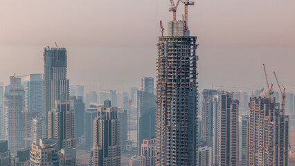 Construction of new modern skyscraper in Dubai city aerial timelapse, United Arab Emirates