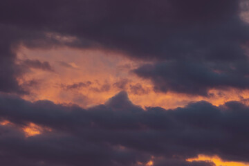 Real majestic sunrise sundown sky background with gentle colorful clouds. Dramatic sunset and sunrise sky. The Cloudy After Rain Sunset. Meteorology. Synoptics. Changes in the weather. Cloud Front.