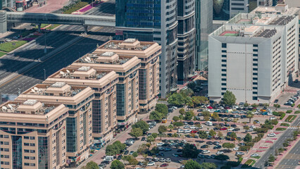 Aerial view to parking lot outdoors vehicles in Dubai downtown timelapse. © HyperlapsePro