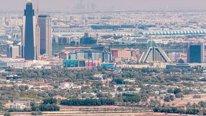 Aerial view of neighborhood Deira and Dubai creek with typical old and modern buildings timelapse.