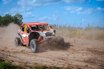 Fototapeta na wymiar ATV, UTV, buggy, rally riding in dusty track. Amateur competitions