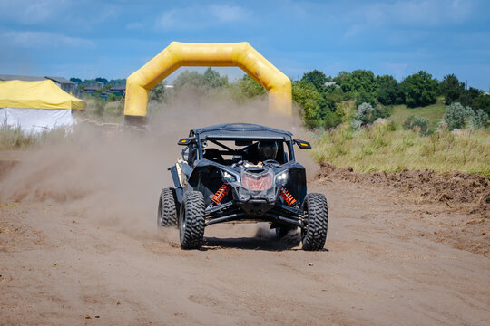 UTV buggy, ATV (quad), 4x4 in the action on sand