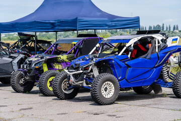 Cool view of active UTV at summer. Extreme ride on 4x4. Parking sport cars