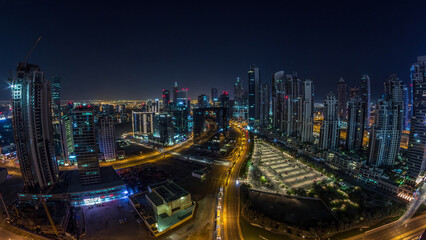 Fototapeta na wymiar Panorama of Business bay Dubai night to day aerial timelapse.